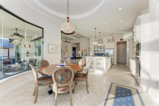 dining room featuring ceiling fan and ornamental molding