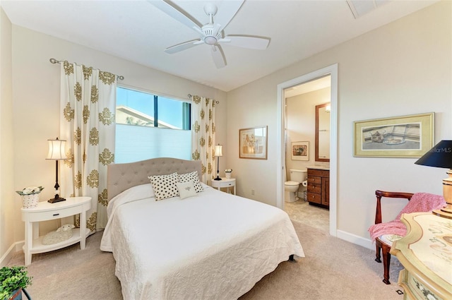 carpeted bedroom featuring connected bathroom and ceiling fan