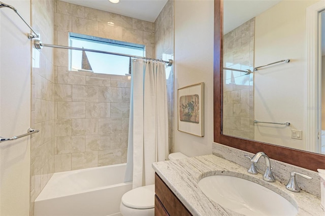 full bathroom with vanity, toilet, and shower / bath combo with shower curtain