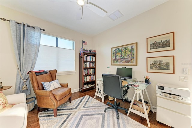 home office featuring ceiling fan and dark hardwood / wood-style flooring