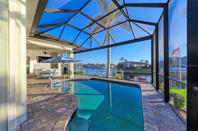 view of swimming pool with a lanai, a patio area, and a bar