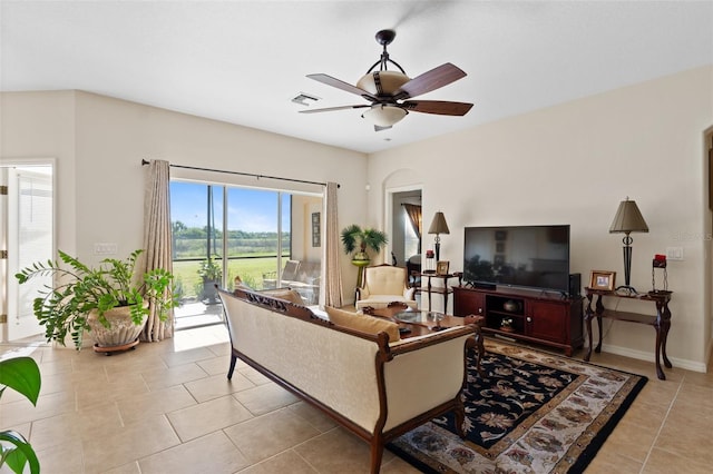 tiled living room featuring ceiling fan