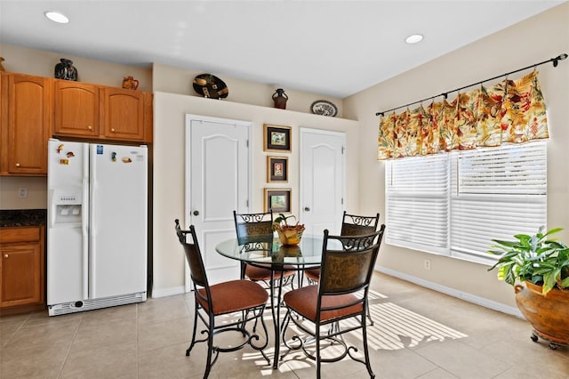 dining space with light tile patterned floors