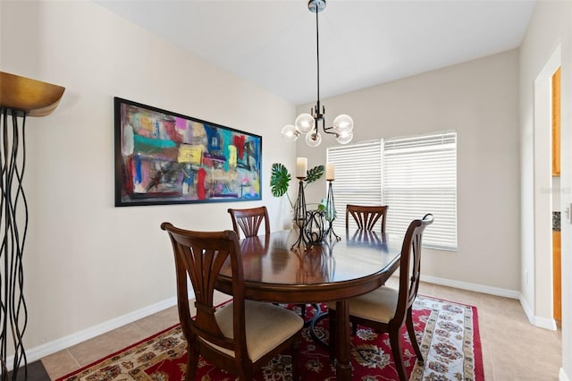 dining room featuring light tile patterned flooring and a notable chandelier