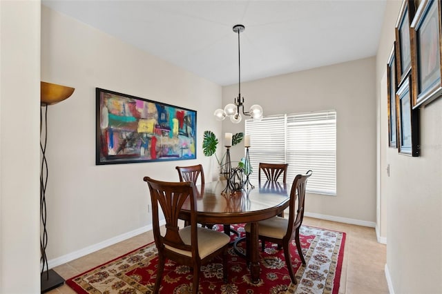 dining room featuring light tile patterned flooring and an inviting chandelier