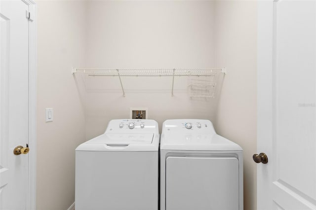 clothes washing area featuring washing machine and dryer