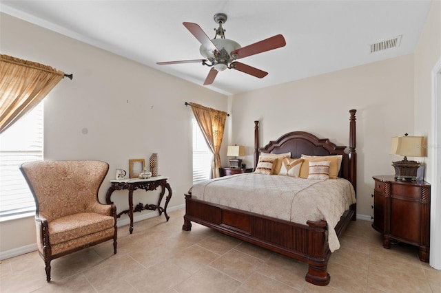 bedroom with ceiling fan and light tile patterned flooring