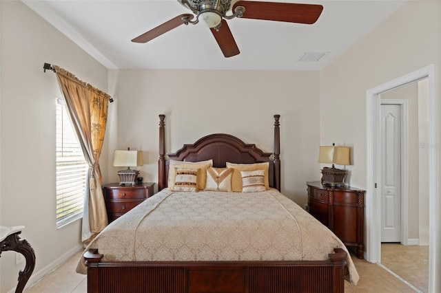 tiled bedroom with ceiling fan