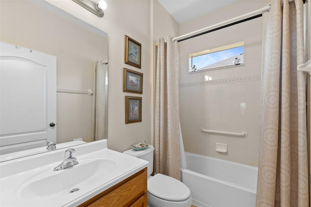 full bathroom with vanity, shower / bath combination with curtain, and toilet