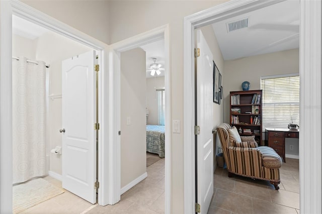 hallway with light tile patterned floors