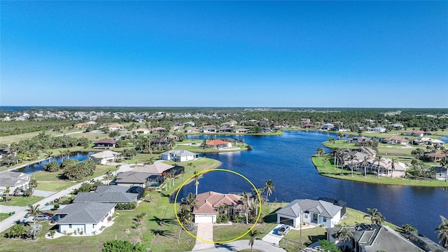 drone / aerial view with a water view