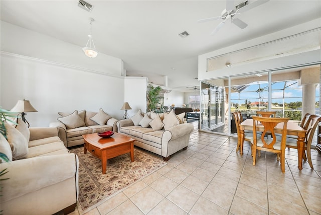 tiled living room with ceiling fan