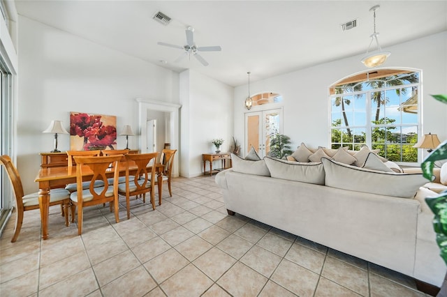 tiled living room featuring ceiling fan