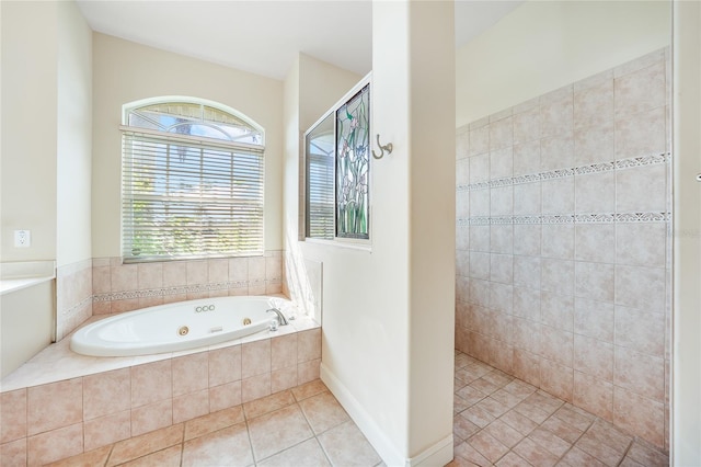 bathroom featuring tile patterned floors and independent shower and bath