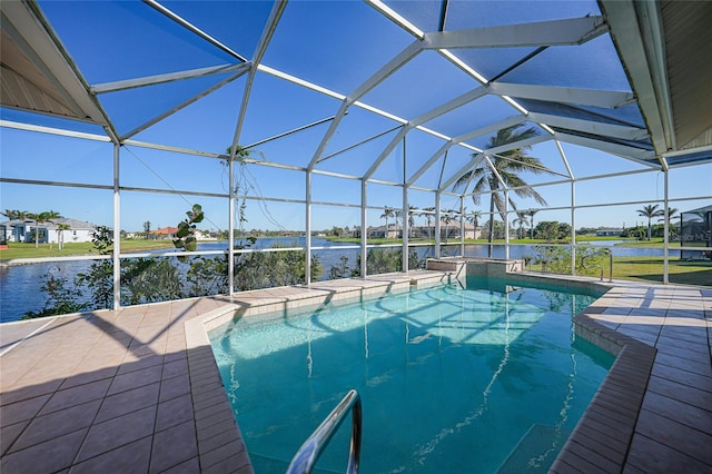 view of pool featuring a patio, a water view, and a lanai