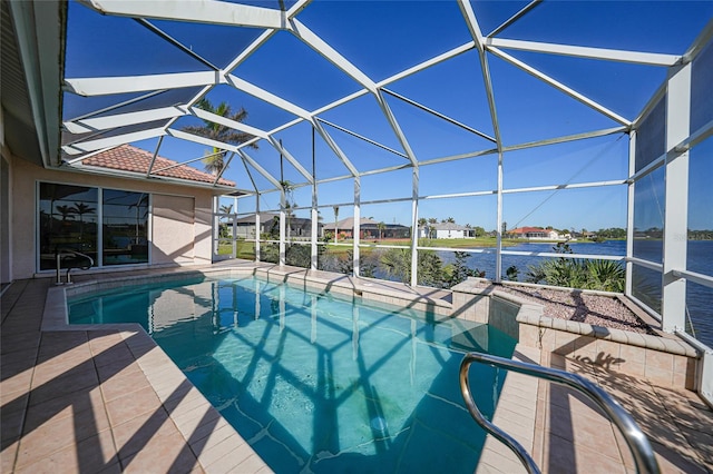 view of pool with a patio, a water view, and glass enclosure