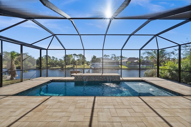 view of pool with a lanai, a patio area, a water view, and a hot tub