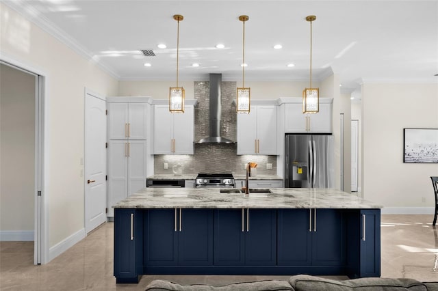 kitchen with white cabinets, wall chimney range hood, stainless steel appliances, and hanging light fixtures