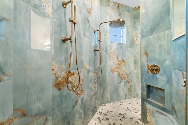 bathroom featuring a tile shower