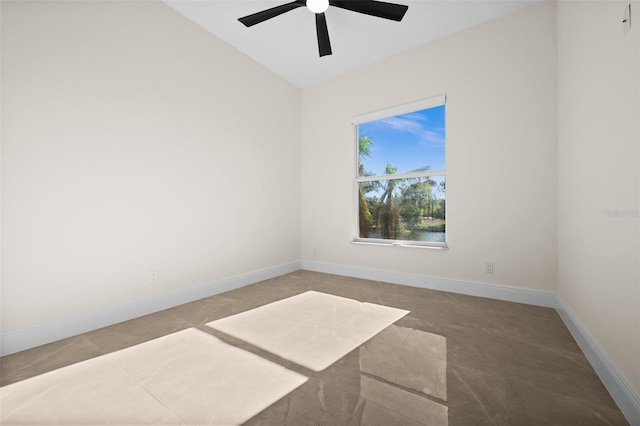 unfurnished room featuring ceiling fan and lofted ceiling