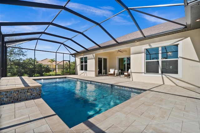 view of pool featuring a patio, ceiling fan, and a lanai