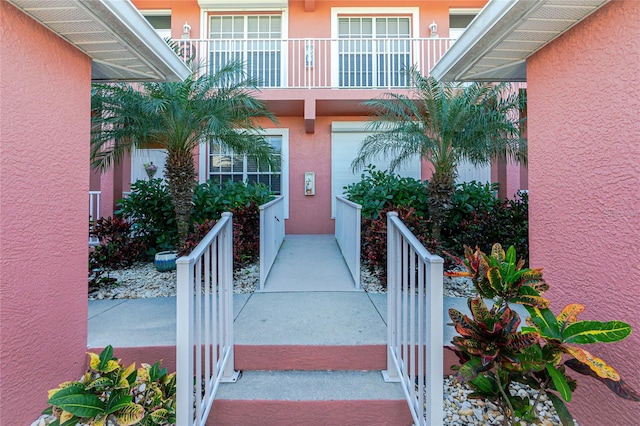 doorway to property featuring a balcony