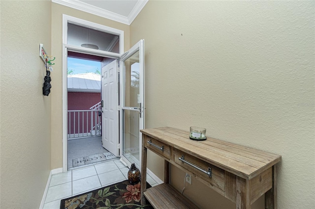 entryway with light tile patterned flooring and crown molding