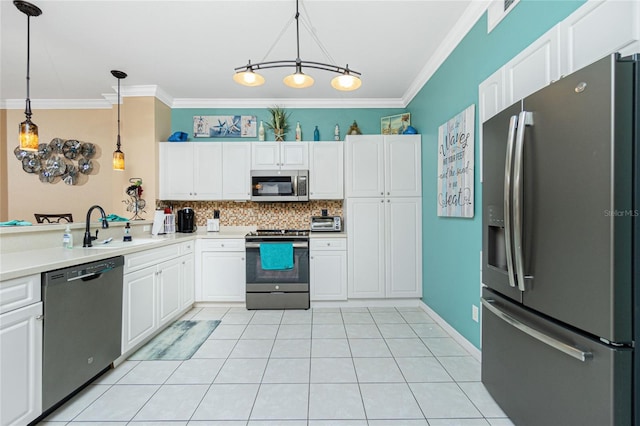 kitchen with white cabinetry, pendant lighting, stainless steel appliances, and sink