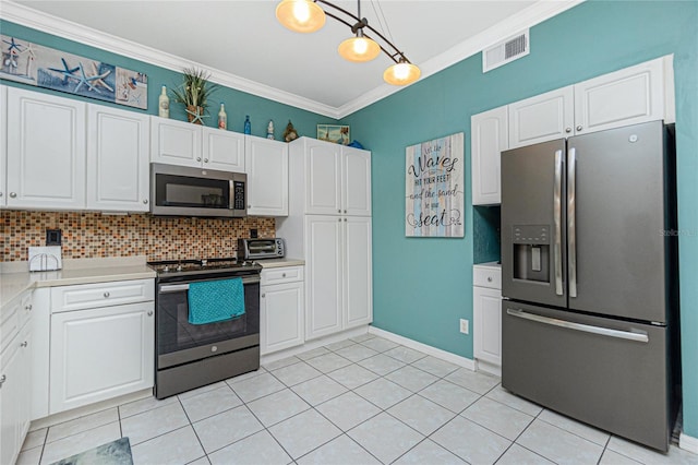 kitchen with appliances with stainless steel finishes, tasteful backsplash, ornamental molding, white cabinets, and hanging light fixtures