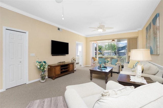 carpeted living room featuring ceiling fan and ornamental molding