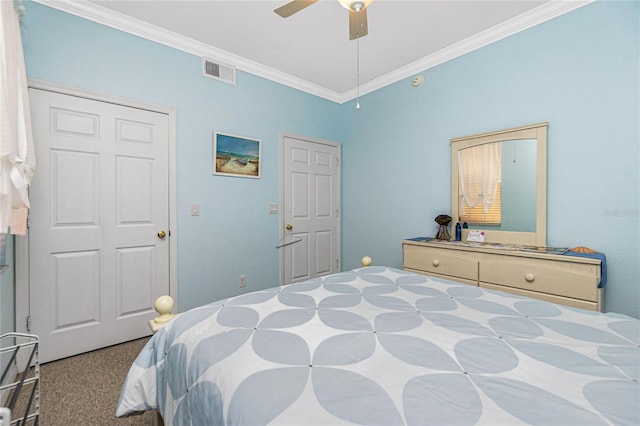 carpeted bedroom with ceiling fan and ornamental molding