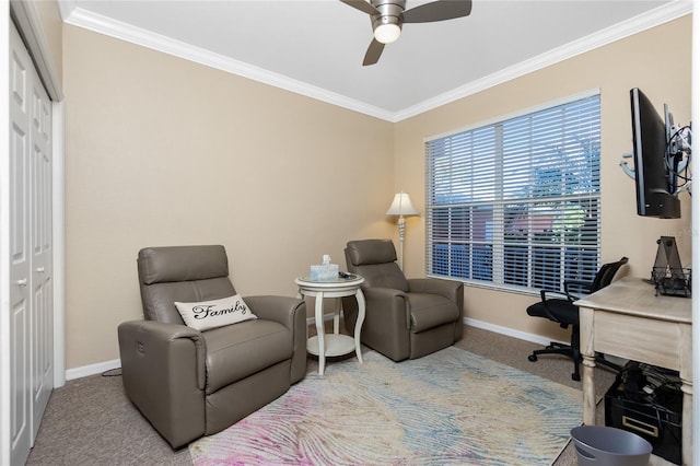 living area featuring carpet flooring, ceiling fan, and ornamental molding