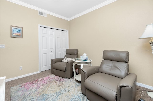 sitting room featuring carpet flooring and crown molding