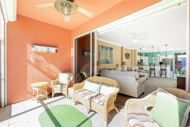 living room featuring light tile patterned flooring and ornamental molding