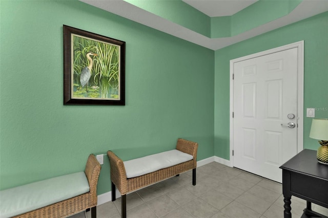 sitting room with light tile patterned floors