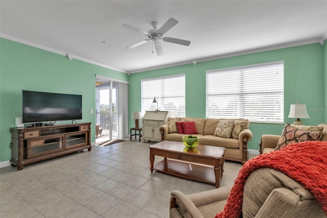 tiled living room with ceiling fan and crown molding