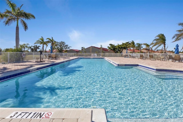 view of swimming pool featuring a patio