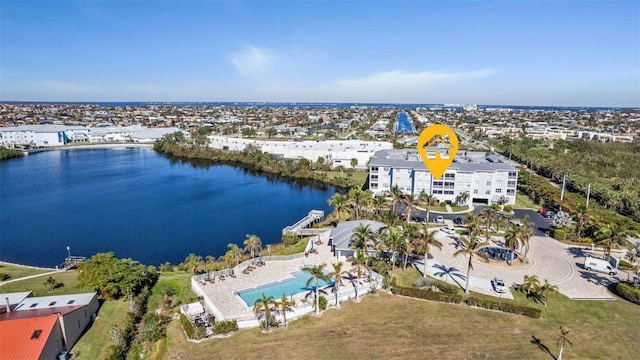 birds eye view of property with a water view