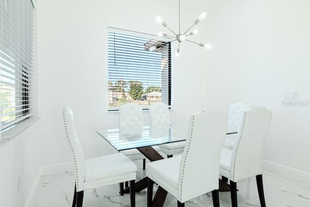 dining room featuring a notable chandelier