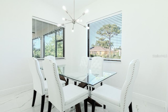 dining room featuring a notable chandelier