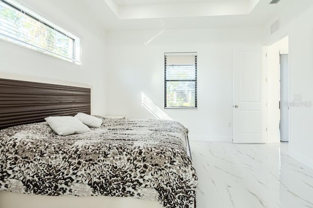 bedroom featuring multiple windows