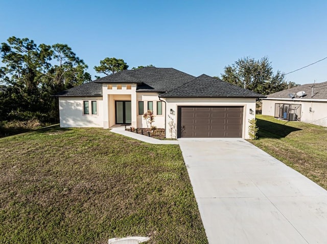 view of front of property featuring a front lawn and a garage