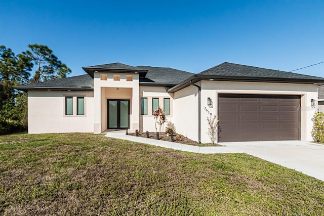 prairie-style house with a front yard and a garage