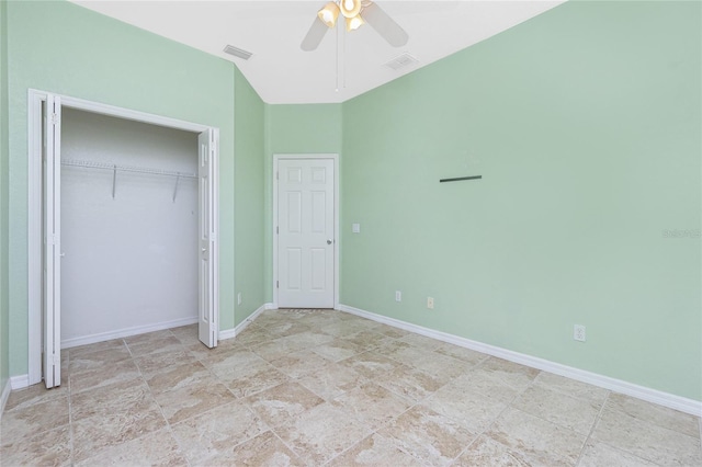 unfurnished bedroom with ceiling fan and a closet