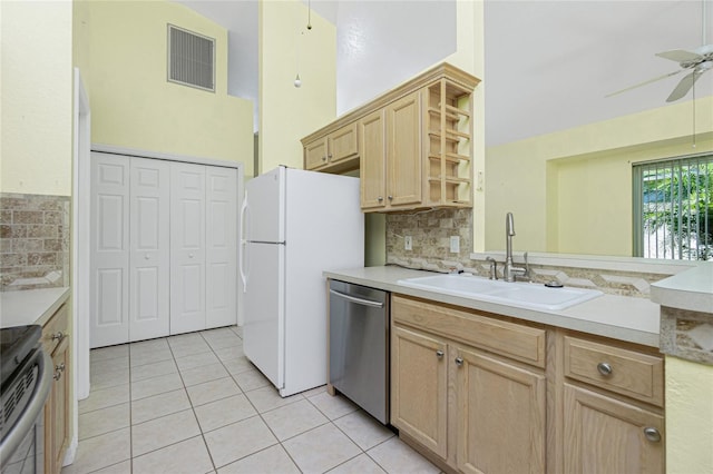 kitchen featuring sink, ceiling fan, light tile patterned floors, light brown cabinetry, and appliances with stainless steel finishes