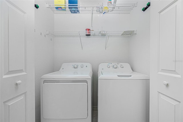 clothes washing area with washer and dryer