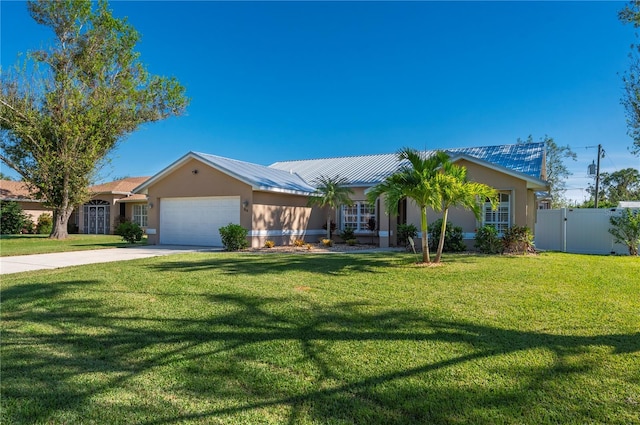 ranch-style house with a garage and a front lawn