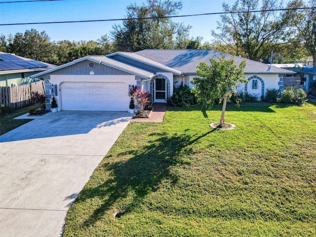 single story home featuring a garage and a front lawn