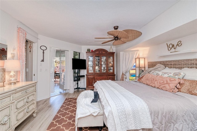 bedroom featuring light hardwood / wood-style floors and ceiling fan