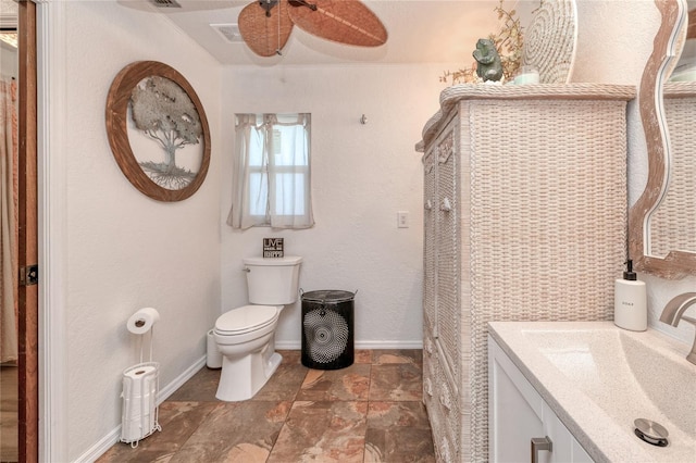 bathroom with vanity, ceiling fan, and toilet